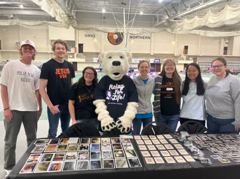 NCF Members at an informational table at Relay for Life.