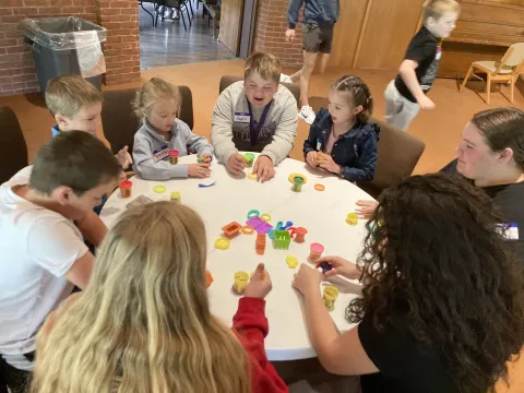 Polar Buddies end of the year party, Bigs and Littles creating things with play doh.